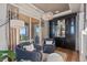 Cozy sitting area with comfortable chairs, modern furnishings, and access to the balcony at 10525 Sunshower Pl, Highlands Ranch, CO 80126