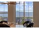 Picturesque view of mountains and neighborhood through a dining room window at 10525 Sunshower Pl, Highlands Ranch, CO 80126