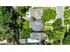 A neighborhood aerial view highlighting well-maintained properties with lush trees, green lawns, and private backyards at 1635 Poplar St, Denver, CO 80220