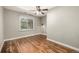 Bedroom showcasing hardwood floors, neutral paint, natural light and ceiling fan at 1635 Poplar St, Denver, CO 80220