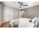 Serene bedroom features a plush bed, wooden floors, and ample storage with closet at 1635 Poplar St, Denver, CO 80220