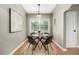 Cozy dining area featuring a modern table, chairs, and stylish light fixture at 1635 Poplar St, Denver, CO 80220