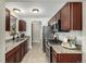 Well-lit kitchen with stainless steel appliances and granite countertops at 1635 Poplar St, Denver, CO 80220