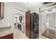 Convenient laundry area with a stacked washer and dryer, plus extra storage at 1635 Poplar St, Denver, CO 80220