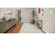 Bright living room with hardwood floors, an area rug, and decor throughout at 1635 Poplar St, Denver, CO 80220