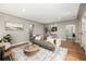 Cozy living room with a comfortable sofa, area rug, and a decorative coffee table at 1635 Poplar St, Denver, CO 80220