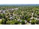 Aerial view of a serene suburban neighborhood with mature trees, and homes nestled among lush greenery at 1635 Poplar St, Denver, CO 80220