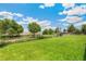 Spacious backyard with lush green grass and partial fencing, perfect for outdoor activities at 5645 W 5Th Ave # 5645 & 5655, Lakewood, CO 80226