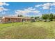 Large fenced backyard with lush green grass, offering privacy and ample space for recreation at 5645 W 5Th Ave # 5645 & 5655, Lakewood, CO 80226