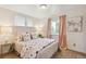 Cozy bedroom with a comfortable queen-size bed and soft, natural light at 5645 W 5Th Ave # 5645 & 5655, Lakewood, CO 80226
