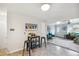 Bright dining area featuring modern accents and flowing open floor plan to living room at 5645 W 5Th Ave # 5645 & 5655, Lakewood, CO 80226