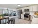 Well-lit kitchen featuring stainless steel appliances and white cabinets at 5645 W 5Th Ave # 5645 & 5655, Lakewood, CO 80226