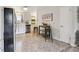 Modern kitchen with stainless steel appliances, white cabinets, and cozy breakfast bar, perfect for casual dining at 5645 W 5Th Ave # 5645 & 5655, Lakewood, CO 80226