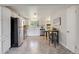Modern kitchen with stainless steel appliances, sleek white cabinets, and stylish eat-in breakfast bar at 5645 W 5Th Ave # 5645 & 5655, Lakewood, CO 80226