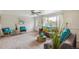 Comfortable living area with plush seating, complemented by stylish decor and natural light from the window at 5645 W 5Th Ave # 5645 & 5655, Lakewood, CO 80226