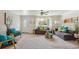 Bright living room with neutral carpet, stylish furniture, and a large window offering ample natural light at 5645 W 5Th Ave # 5645 & 5655, Lakewood, CO 80226
