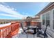 Deck with outdoor seating, a fire pit, and panoramic views of the snowy landscape at 7958 S Algonquian Ct, Aurora, CO 80016