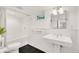 Elegant bathroom featuring a classic pedestal sink, subway tile walls, and modern fixtures for a luxurious feel at 1226 Dexter St, Denver, CO 80220