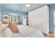 Comfortable bedroom featuring built-in wardrobe storage and a window with views at 1226 Dexter St, Denver, CO 80220