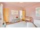 Warm Bedroom featuring crib, storage unit, and decorative map for a cozy atmosphere at 1226 Dexter St, Denver, CO 80220