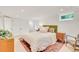 Relaxing bedroom featuring a closet, decorative rug, and a neutral color palette at 1226 Dexter St, Denver, CO 80220