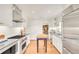 Modern kitchen featuring stainless steel appliances, subway tile backsplash, and ample cabinet space at 1226 Dexter St, Denver, CO 80220