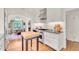 Updated kitchen with chef's oven and range and a butcher block island, and breakfast nook at 1226 Dexter St, Denver, CO 80220