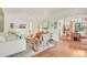 Bright living room featuring hardwood floors, white walls, and stylish contemporary furniture and fixtures at 1226 Dexter St, Denver, CO 80220
