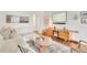 Inviting living area with hardwood floors, glass coffee table, and a comfortable white sofa at 1226 Dexter St, Denver, CO 80220