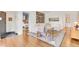 Cozy living room with hardwood floors and modern furnishings with a peek into the blue bedroom at 1226 Dexter St, Denver, CO 80220