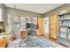 Well-appointed office with modern desk, built-in shelving, and plenty of natural light at 1226 Dexter St, Denver, CO 80220