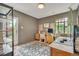 Inviting home office with natural light, built-in shelving, and a stylish area rug at 1226 Dexter St, Denver, CO 80220