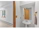 Cozy bathroom features a modern sink with a mirror and towel rack at 10747 Timothys Dr, Conifer, CO 80433