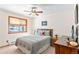 Comfortable bedroom with ceiling fan, wood furniture and exterior window at 10747 Timothys Dr, Conifer, CO 80433