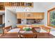Warm dining space with wood accents and a loft, perfect for entertaining guests at 10747 Timothys Dr, Conifer, CO 80433