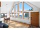 Bright dining area with large windows showcasing mountain views and ample natural light at 10747 Timothys Dr, Conifer, CO 80433