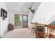 Game room featuring vaulted ceilings, deck access with views and barrel table at 10747 Timothys Dr, Conifer, CO 80433