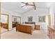 Spacious main bedroom featuring wood beam ceiling, large closet and hardwood furniture at 10747 Timothys Dr, Conifer, CO 80433