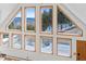 Mountain home windows showcasing scenic views of snow-covered landscape and forest at 10747 Timothys Dr, Conifer, CO 80433