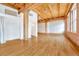 Spacious open-plan living area with high ceilings, exposed beams, and hardwood floors at 1745 Wazee St # 2B, Denver, CO 80202
