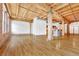 Bright, open living space featuring exposed wood beams and hardwood floors at 1745 Wazee St # 2B, Denver, CO 80202
