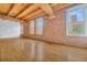 Spacious open space with brick walls, exposed beams, and large windows at 1745 Wazee St # 2B, Denver, CO 80202
