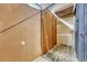 Spacious storage unit with secured cage with wood floor and wood-paneled walls at 1745 Wazee St # 2B, Denver, CO 80202