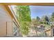 Balcony view with trees, parking area, and neighboring buildings at 5950 Gunbarrel Ave # F, Boulder, CO 80301