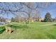 Beautiful green with walking paths and benches in a well-maintained residential community on a sunny day at 5950 Gunbarrel Ave # F, Boulder, CO 80301