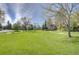 Expansive green space with walking path, mature trees, and a clear blue sky providing a serene park-like setting at 5950 Gunbarrel Ave # F, Boulder, CO 80301