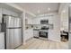 Modern kitchen with stainless steel appliances and bright white cabinets at 5950 Gunbarrel Ave # F, Boulder, CO 80301