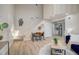 Open-concept living room with dining area, stairs, and a partial view of the kitchen at 5950 Gunbarrel Ave # F, Boulder, CO 80301