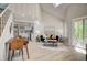 Bright living room featuring vaulted ceilings, skylights, and an open floor plan to the kitchen at 5950 Gunbarrel Ave # F, Boulder, CO 80301