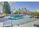 View of the community pool covered for the off-season, with lounge seating and mature trees nearby at 5950 Gunbarrel Ave # F, Boulder, CO 80301